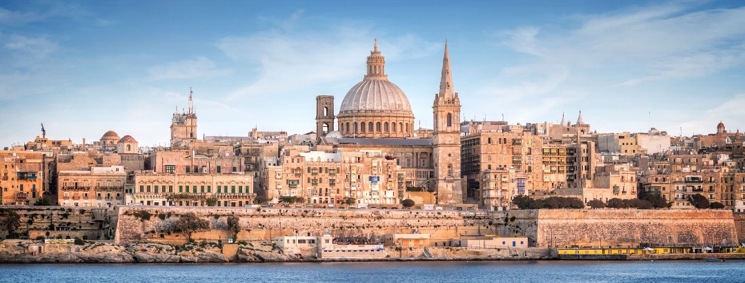 Travel Guide Malta - The skyline of Valletta with St Paul's Cathedral.